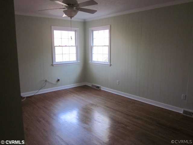 17601 Beach Road Chesterfield, VA 23838 - Photo 6 of 12 an empty room with wooden floor and windows