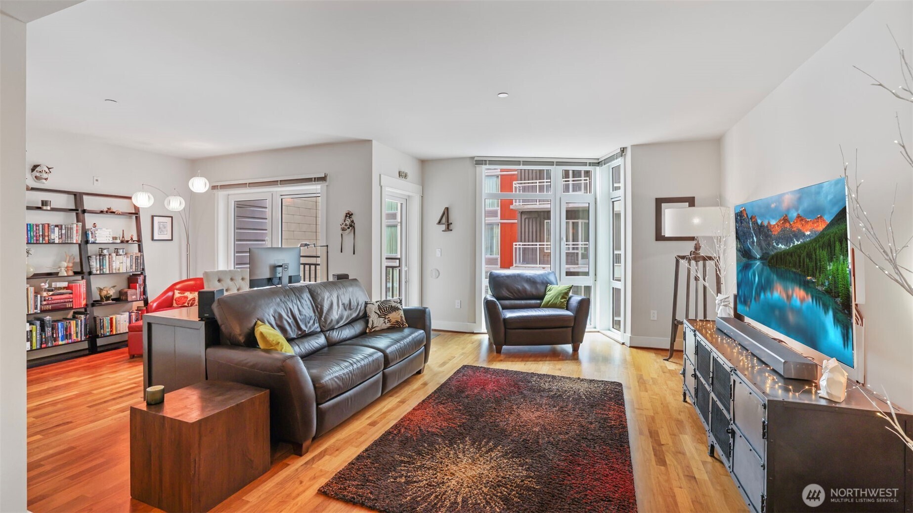 699 John Street, Unit 513 Seattle, WA 98109 - Photo 11 of 33 a living room with furniture and a flat screen tv