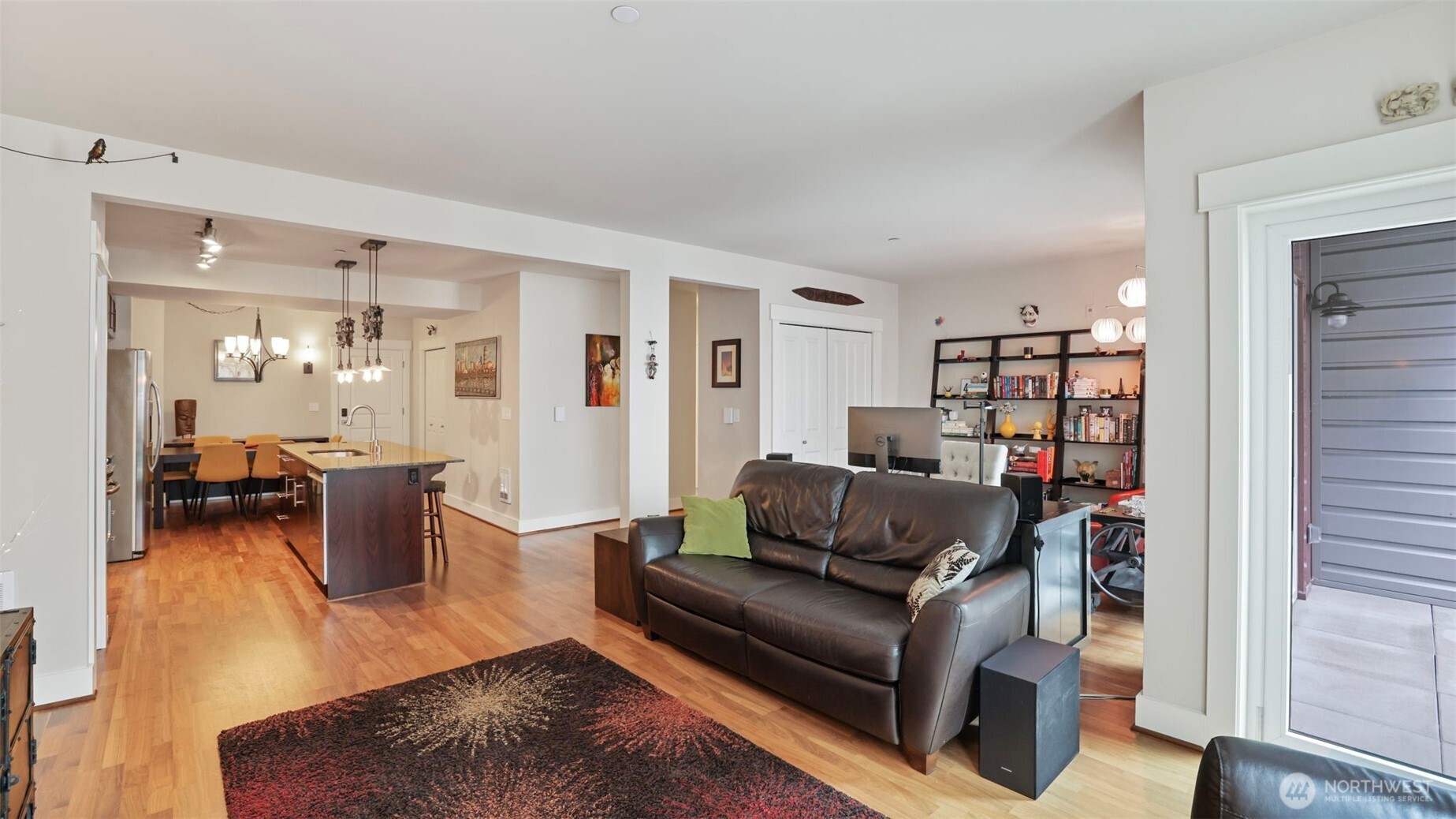 699 John Street, Unit 513 Seattle, WA 98109 - Photo 15 of 33 a living room with furniture and a wooden floor