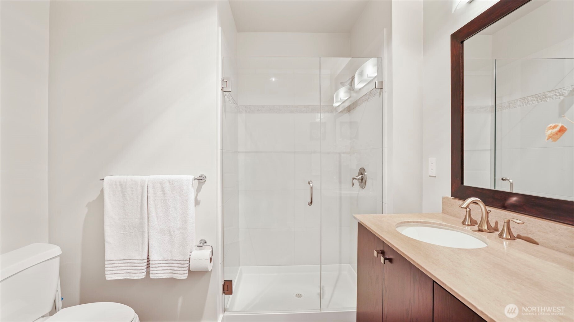 699 John Street, Unit 513 Seattle, WA 98109 - Photo 18 of 33 a bathroom with a sink toilet vanity and shower