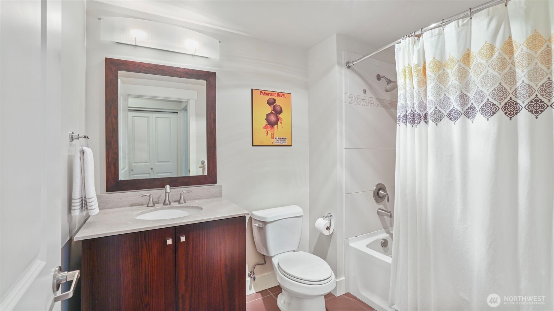 699 John Street, Unit 513 Seattle, WA 98109 - Photo 20 of 33 a bathroom with a toilet a sink and a large mirror