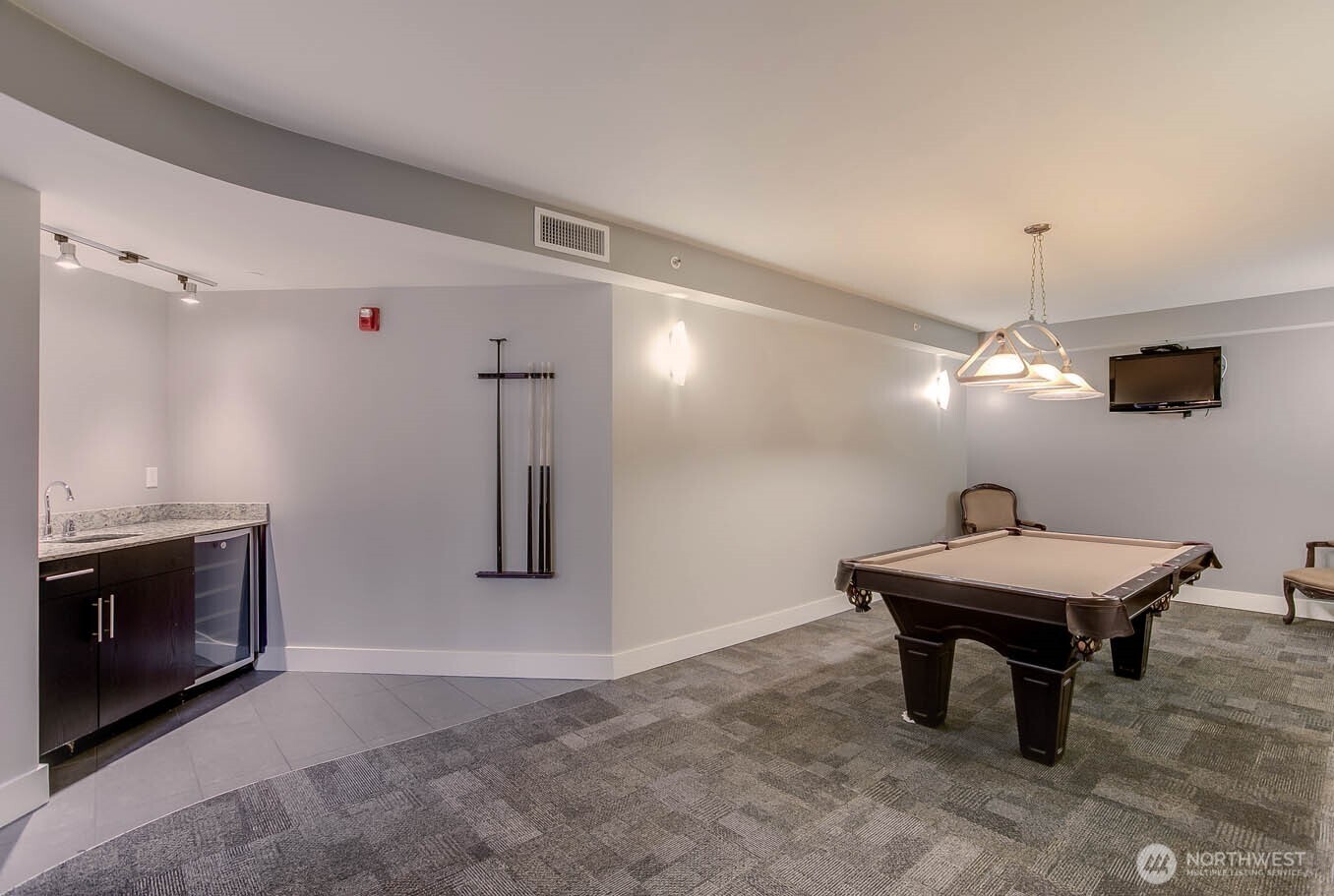 699 John Street, Unit 513 Seattle, WA 98109 - Photo 30 of 33 a room with furniture and a chandelier
