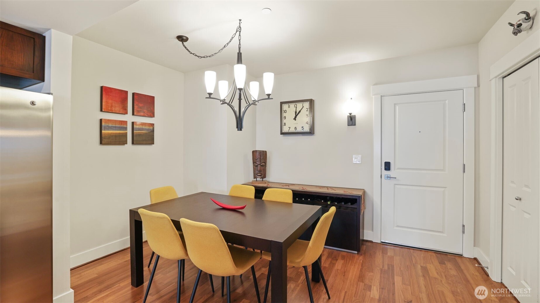 699 John Street, Unit 513 Seattle, WA 98109 - Photo 8 of 33 a view of a dining room with furniture and wooden floor
