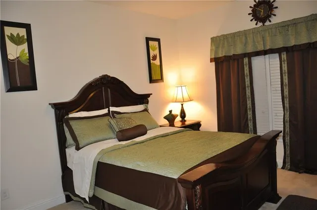 a bedroom with a bed and a dresser