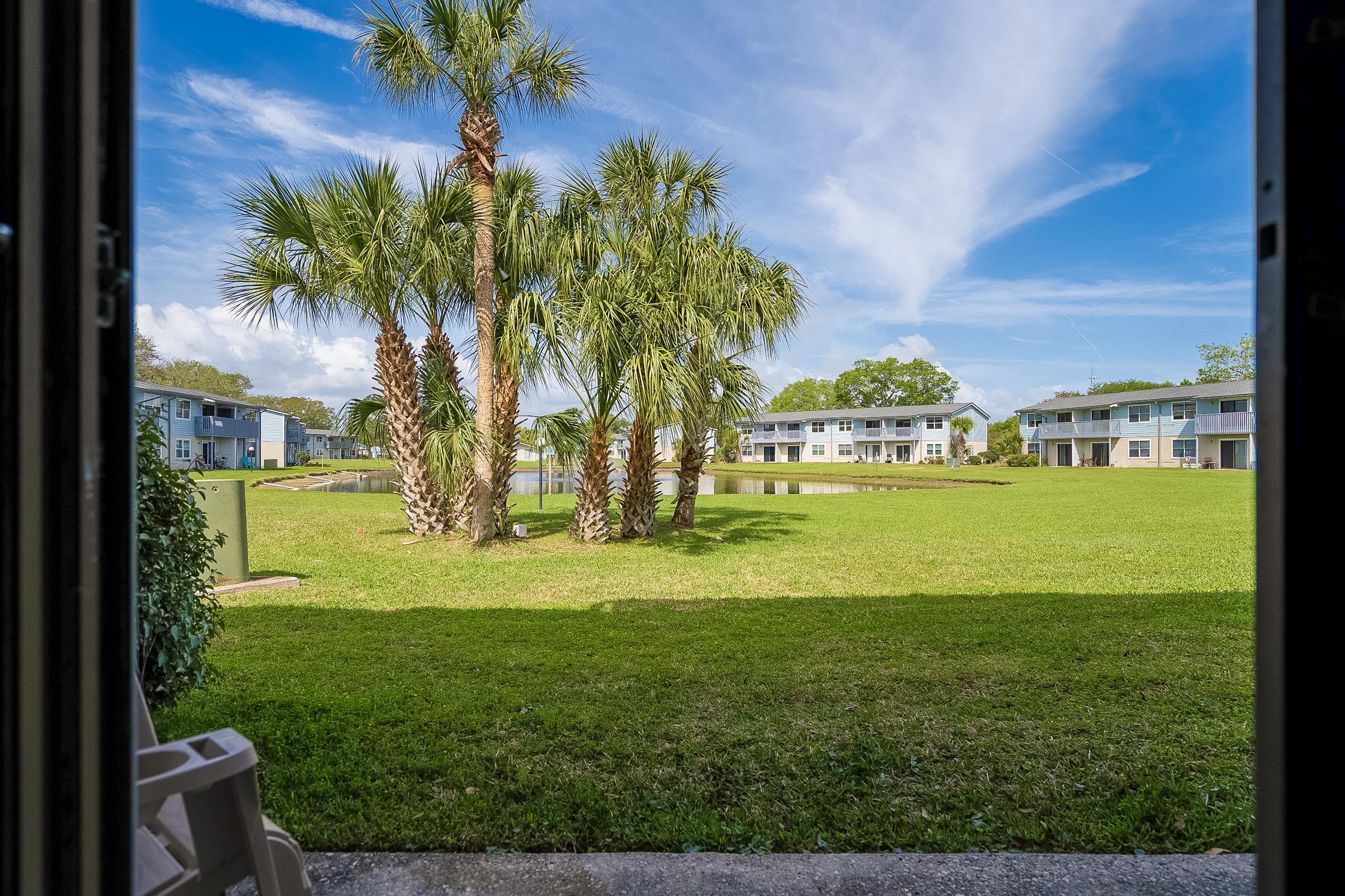 700 West Pope Road, Unit H57 St. Augustine, FL 32080 - Photo 13 of 52 View of green lawn with a water view