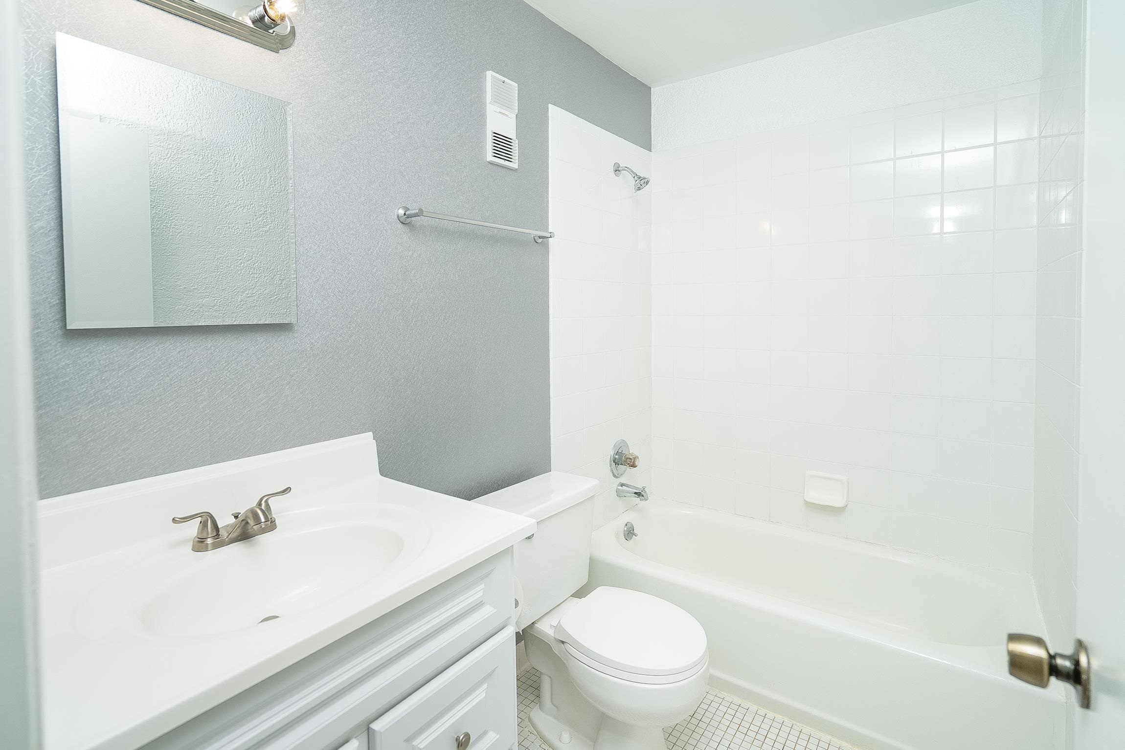 700 West Pope Road, Unit H57 St. Augustine, FL 32080 - Photo 22 of 52 Full bath with a textured wall, vanity, and shower / washtub combination