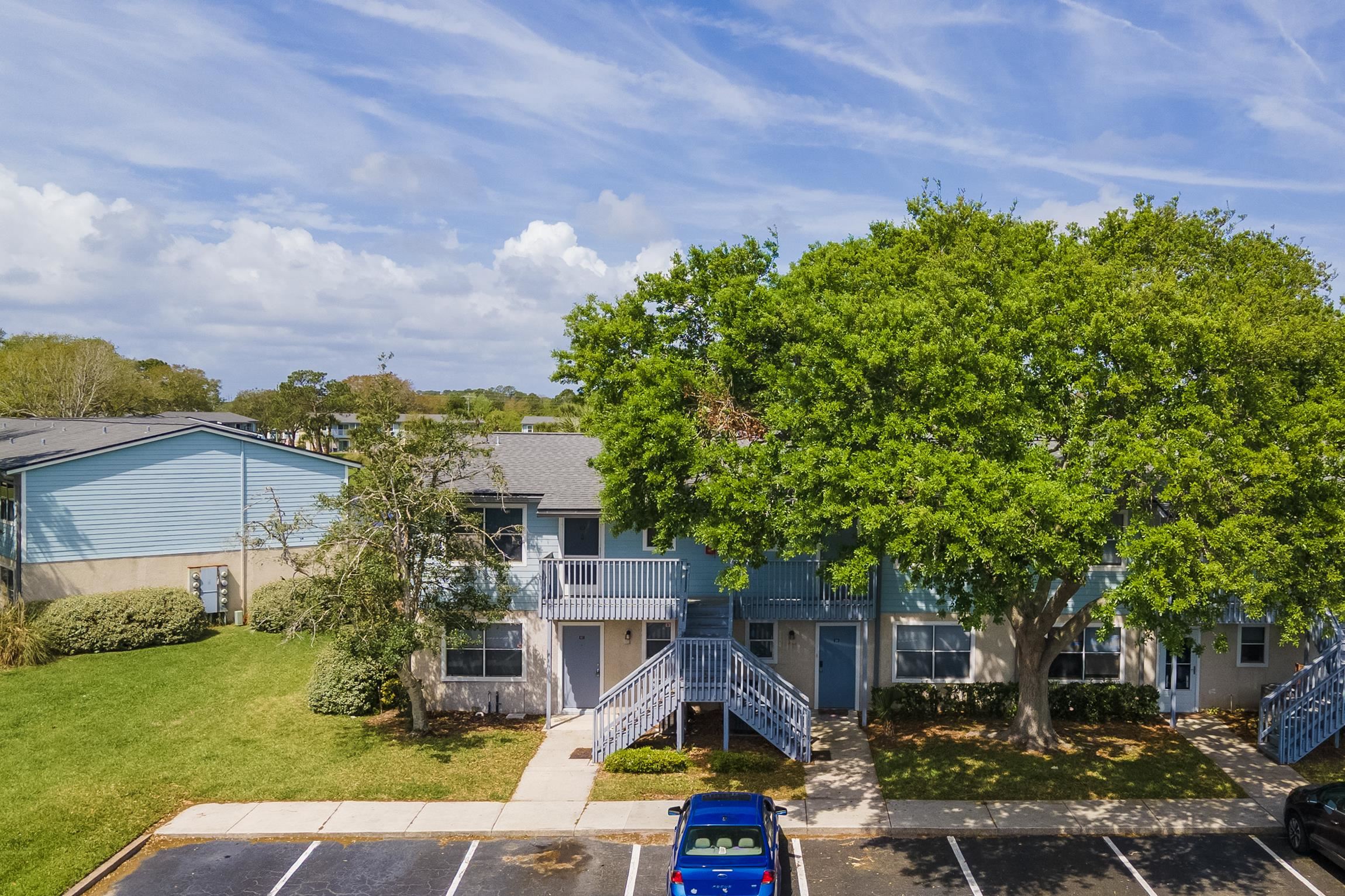 700 West Pope Road, Unit H57 St. Augustine, FL 32080 - Photo 27 of 52 View of property featuring stairway and uncovered parking