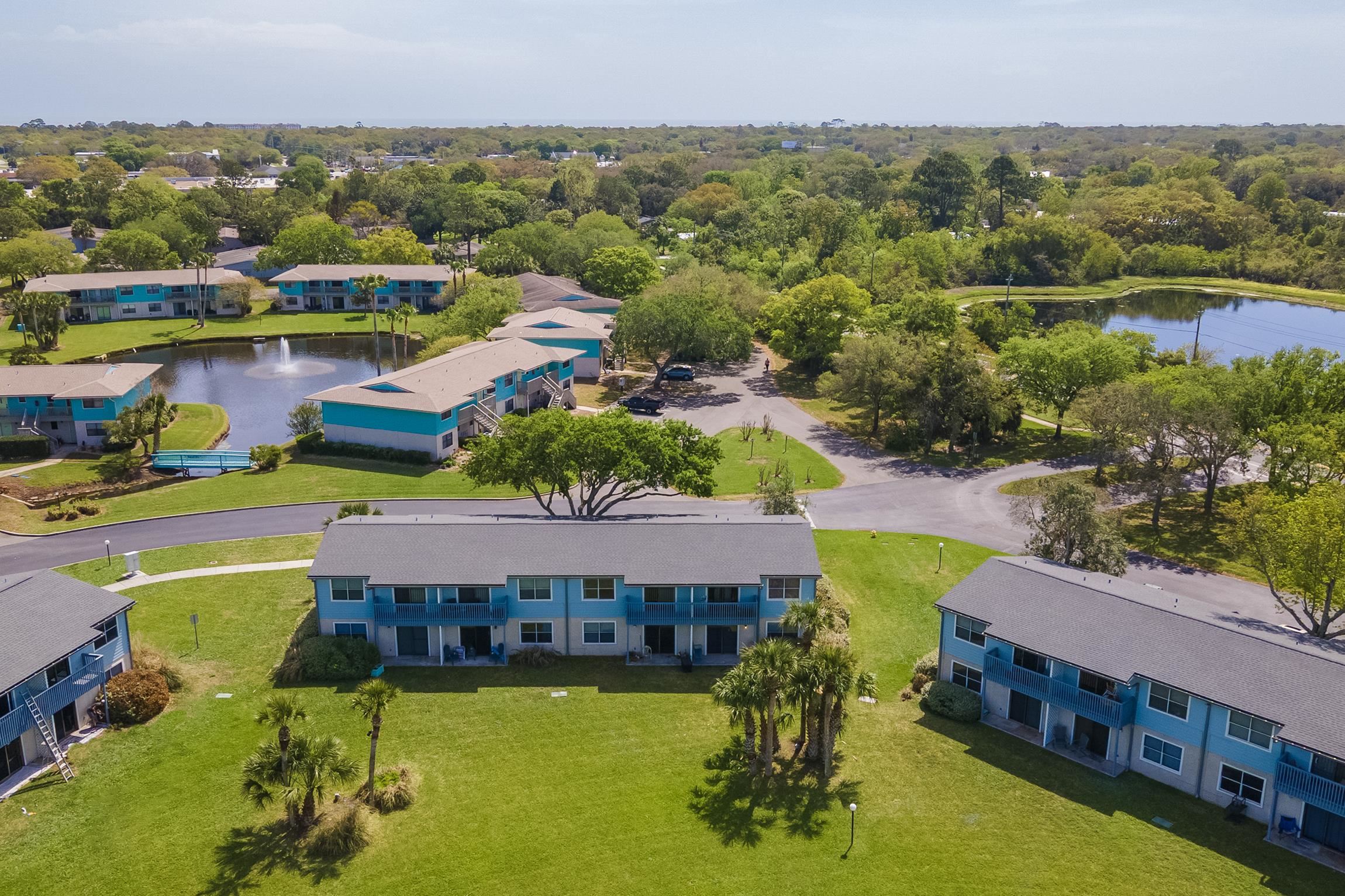 700 West Pope Road, Unit H57 St. Augustine, FL 32080 - Photo 37 of 52 Bird's eye view of a nearby body of water and a tree filled landscape