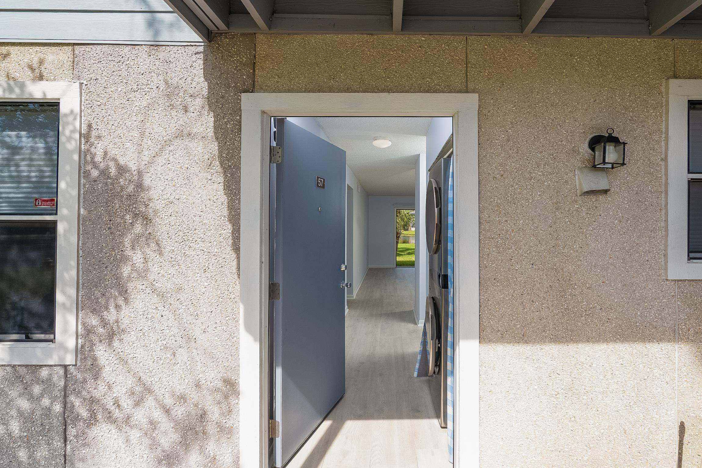 700 West Pope Road, Unit H57 St. Augustine, FL 32080 - Photo 5 of 52 Property entrance with stucco siding