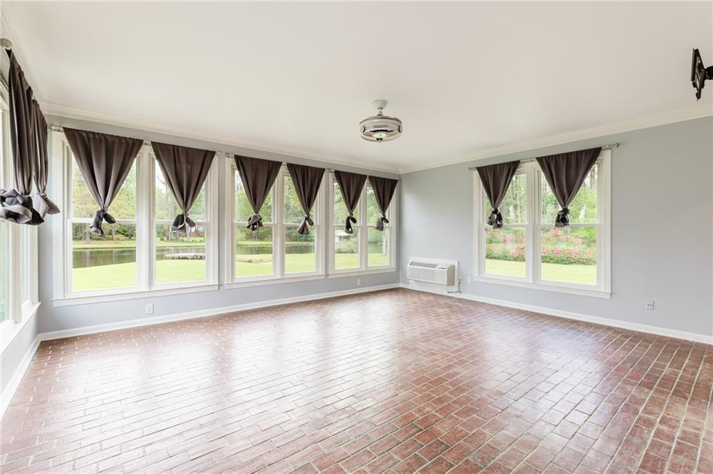 434 Rawley Road Americus, GA 31719 - Photo 32 of 50 wooden floor in an empty room with a window