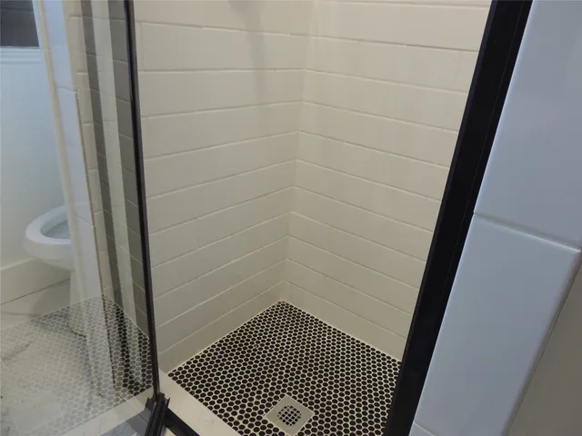 a bathroom with a sink and a shower