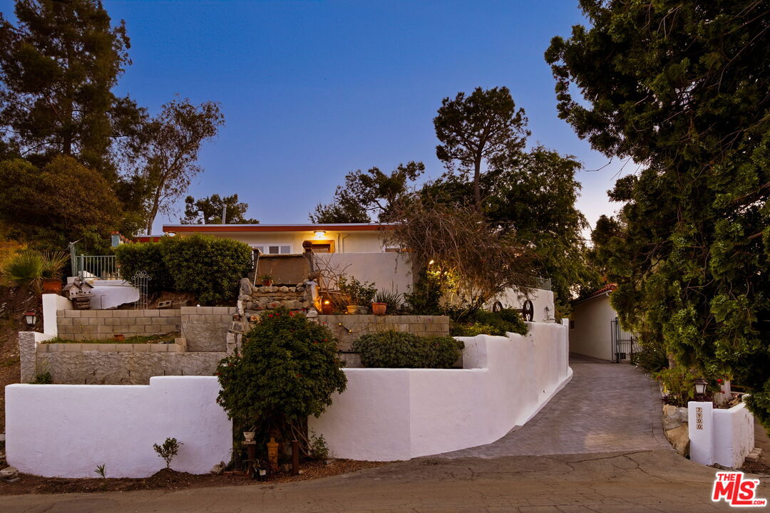 7900 Rim Canyon Road Sunland, CA 91040 - Photo 1 of 46 a view of a house with a yard