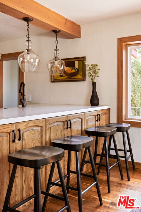 7900 Rim Canyon Road Sunland, CA 91040 - Photo 13 of 46 a view of a dining room with furniture and wooden floor
