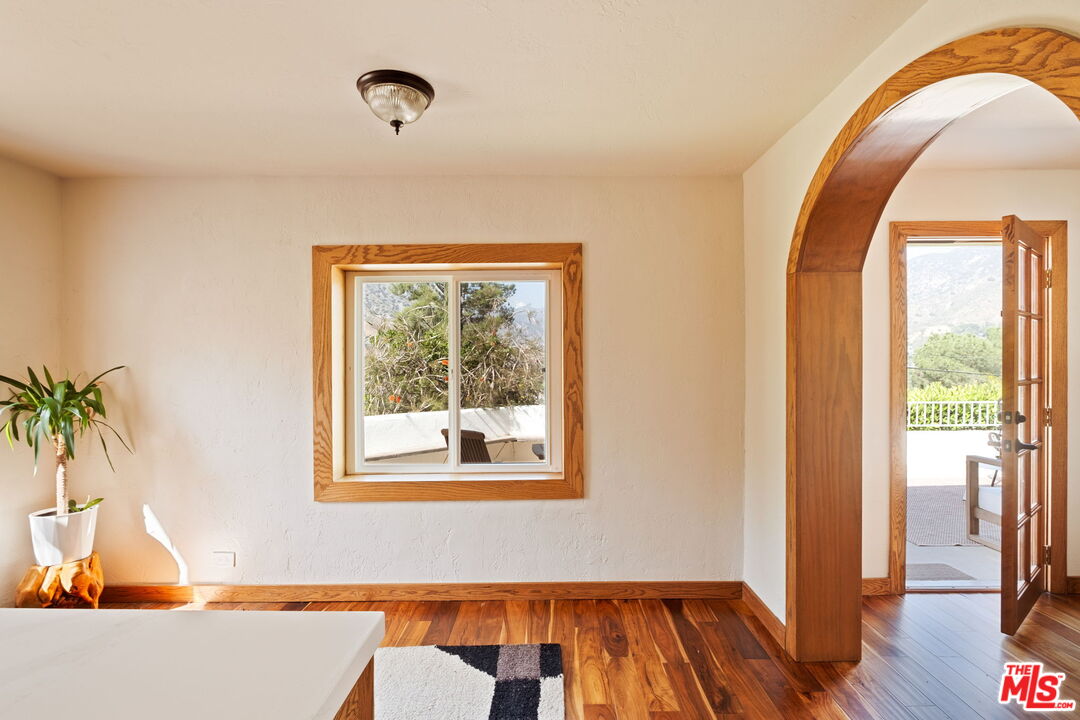 7900 Rim Canyon Road Sunland, CA 91040 - Photo 15 of 46 a view of a room with wooden floor and a window