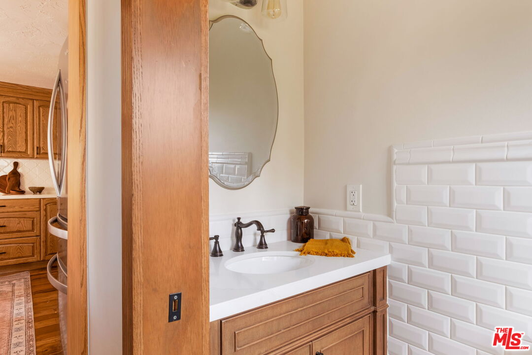 7900 Rim Canyon Road Sunland, CA 91040 - Photo 20 of 46 a bathroom with a sink and a mirror