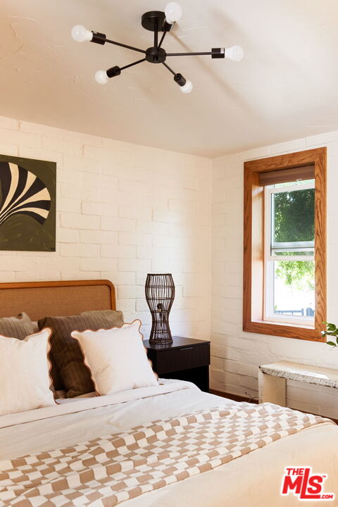 7900 Rim Canyon Road Sunland, CA 91040 - Photo 23 of 46 a bedroom with a bed and a window