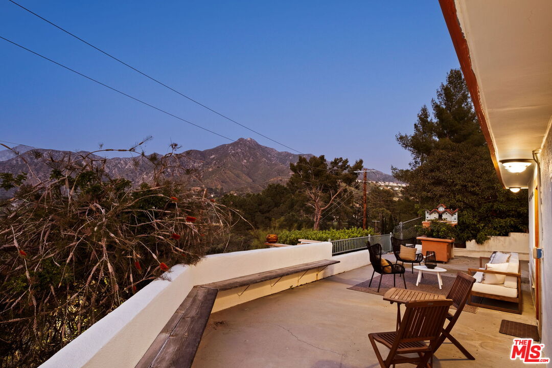 7900 Rim Canyon Road Sunland, CA 91040 - Photo 27 of 46 a view of a chairs and table in patio