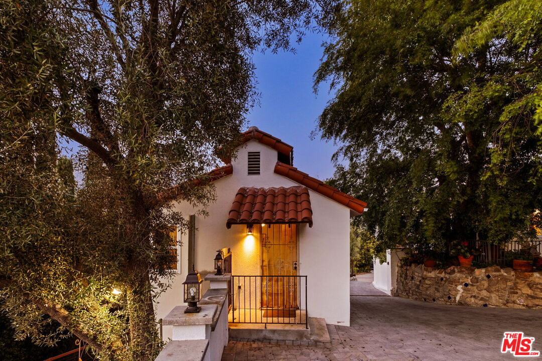 7900 Rim Canyon Road Sunland, CA 91040 - Photo 30 of 46 a front view of a house with a yard