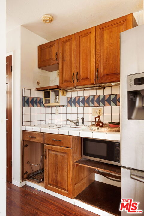 7900 Rim Canyon Road Sunland, CA 91040 - Photo 32 of 46 a view of a kitchen with granite countertop a stove and a sink