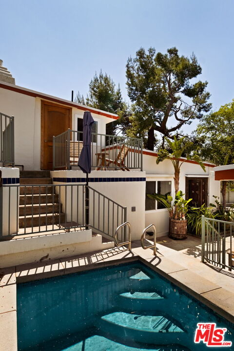 7900 Rim Canyon Road Sunland, CA 91040 - Photo 38 of 46 a view of house with swimming pool outdoor seating