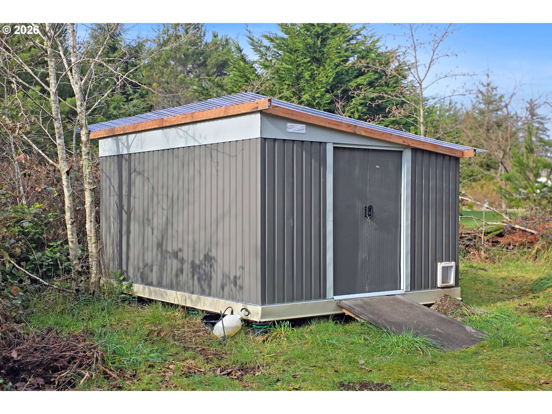 5591 Chittum Loop Florence, OR 97439 - Photo 18 of 23 a backyard of a house with lots of green space