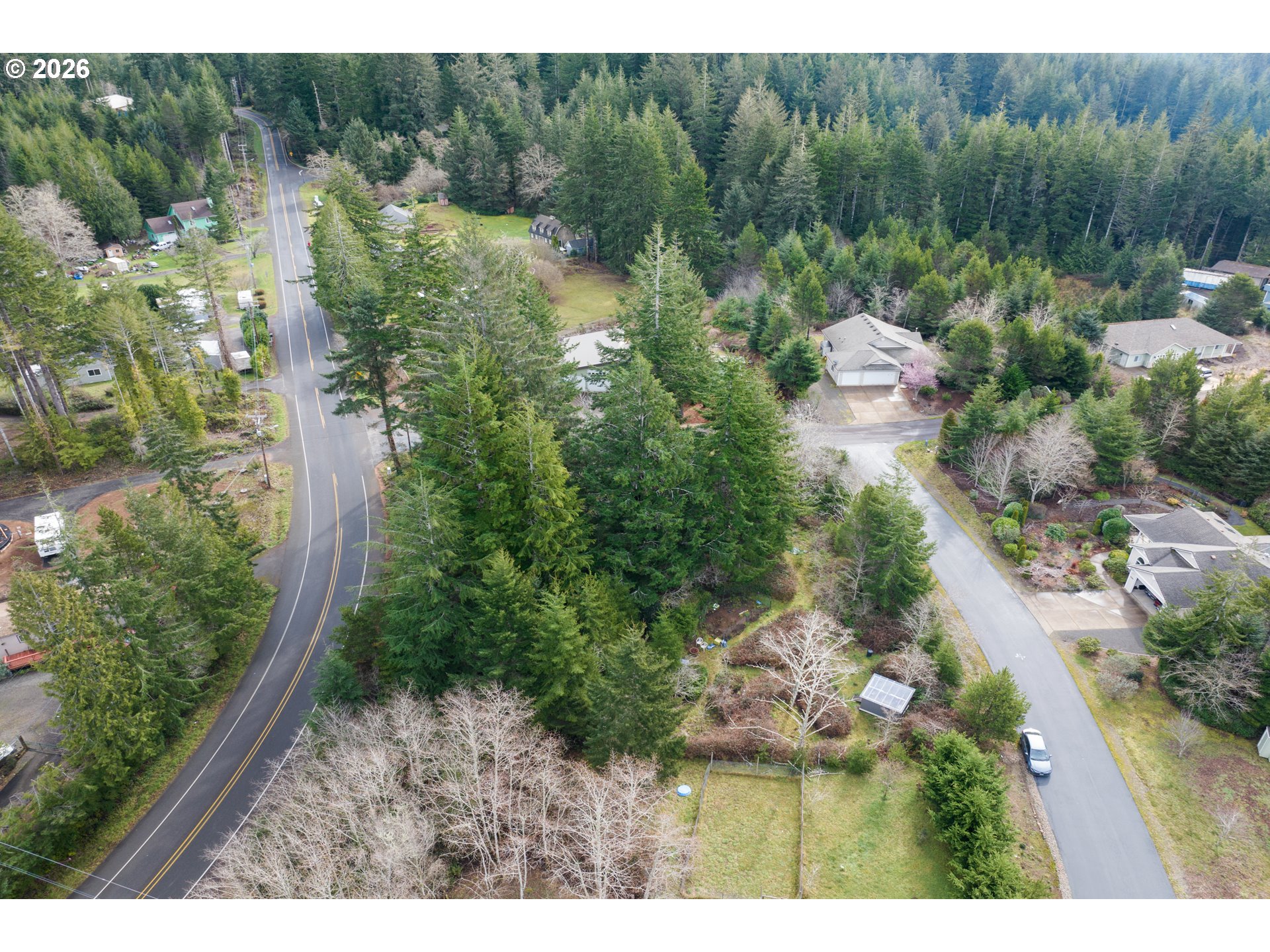 5591 Chittum Loop Florence, OR 97439 - Photo 8 of 23 a view of a house with a park