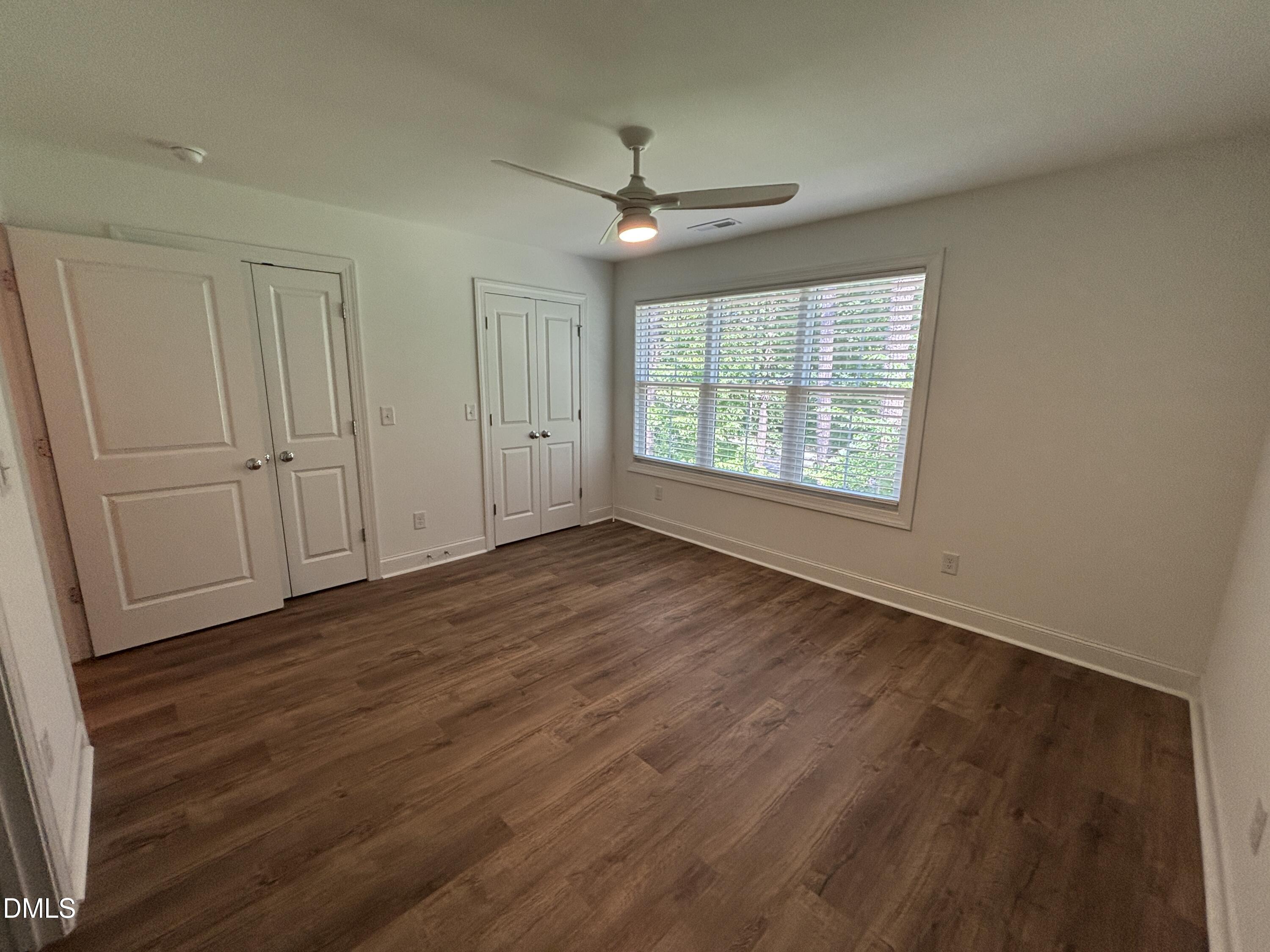 5710 Parker Pnes Court Raleigh, NC 27609 - Photo 43 of 78 wooden floor in an empty room with a window