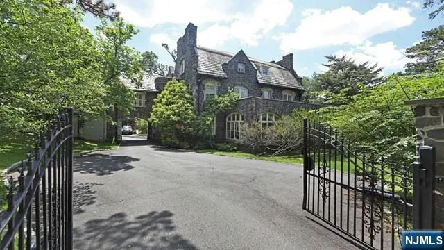 a view of a house with a street