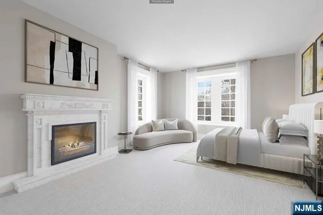 a bedroom with a bed and a potted plant