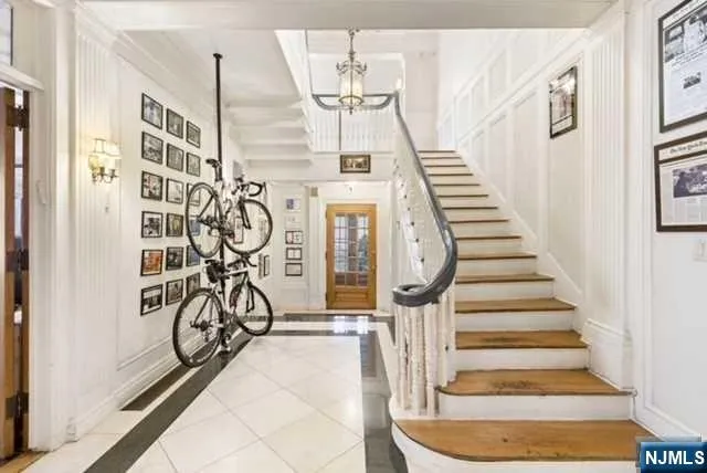 a view of an entryway with wooden floor