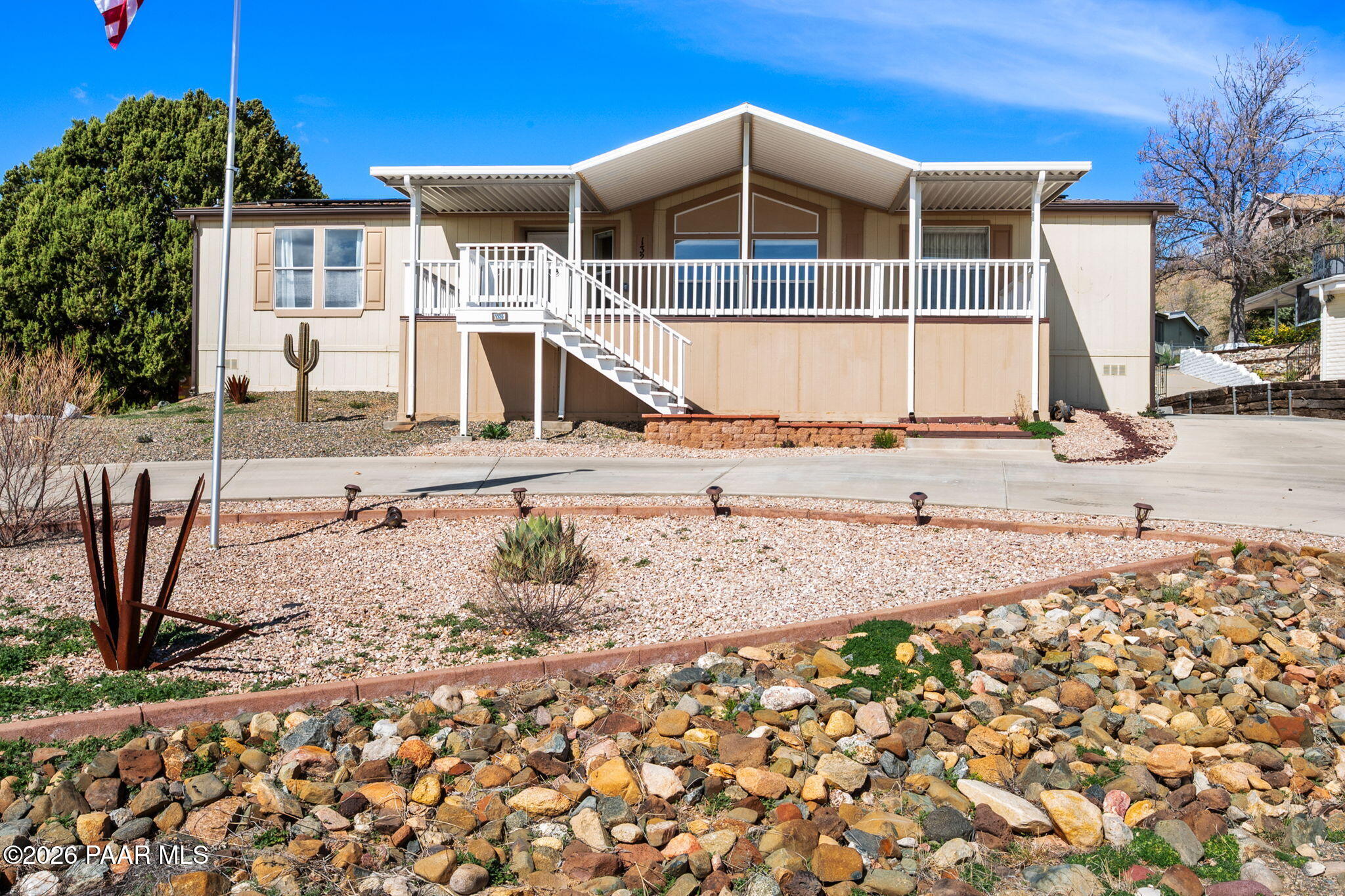 1320 Chestnut Trail Dewey, AZ 86327 - Photo 1 of 32 a front view of a house with a yard