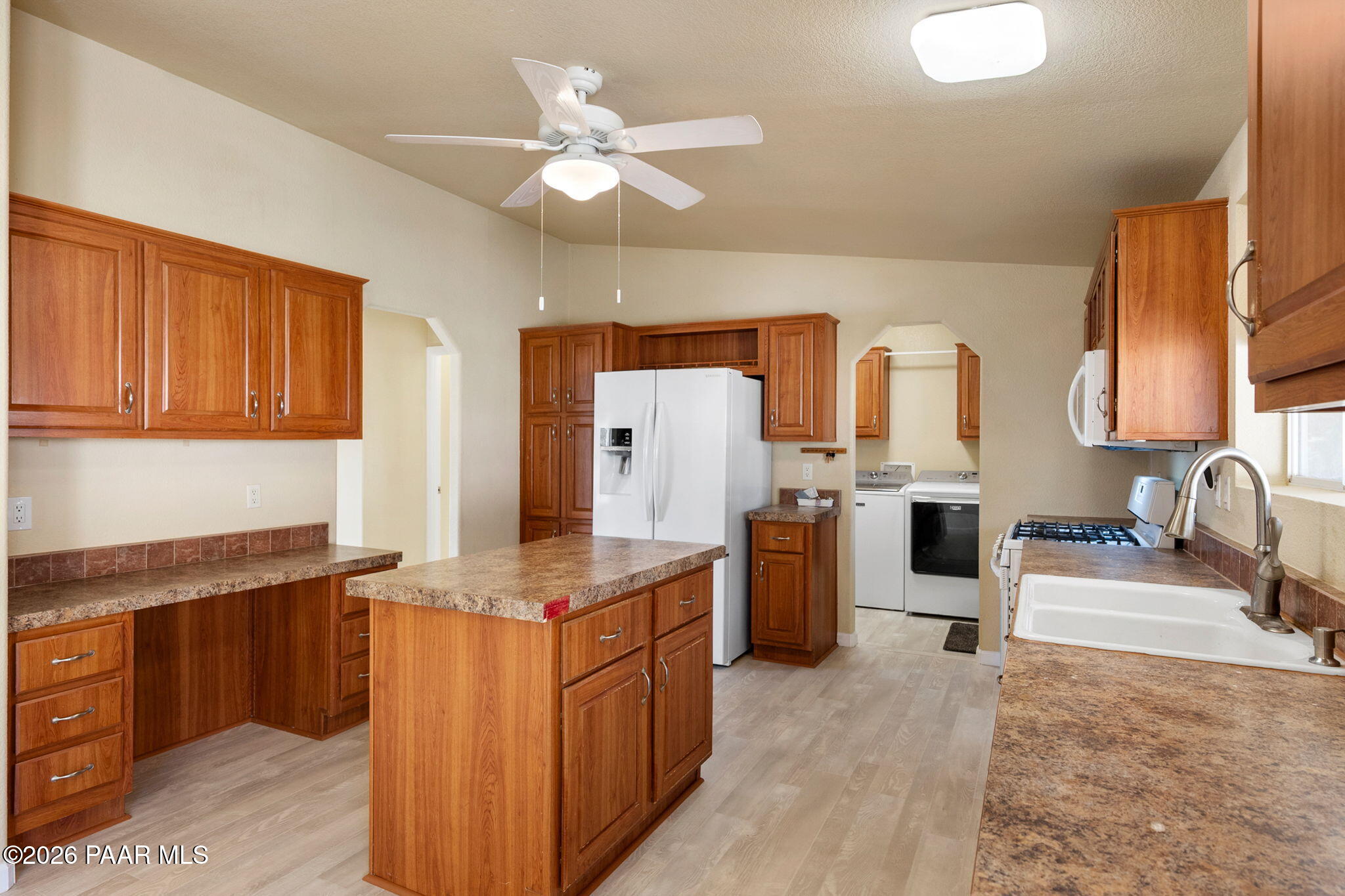 1320 Chestnut Trail Dewey, AZ 86327 - Photo 15 of 32 a kitchen with stainless steel appliances granite countertop a sink stove and refrigerator