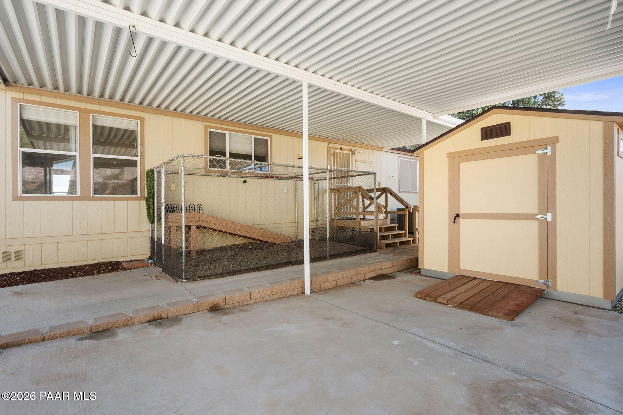 1320 Chestnut Trail Dewey, AZ 86327 - Photo 28 of 32 a view of a house with a wooden door
