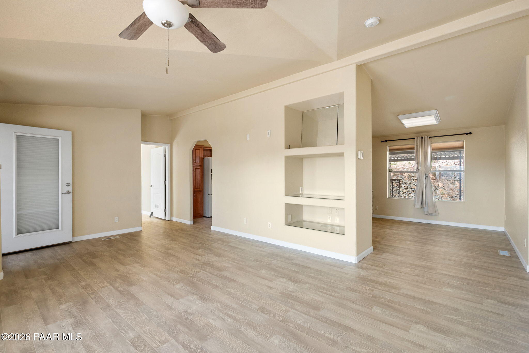1320 Chestnut Trail Dewey, AZ 86327 - Photo 10 of 32 wooden floor in an empty room with a window