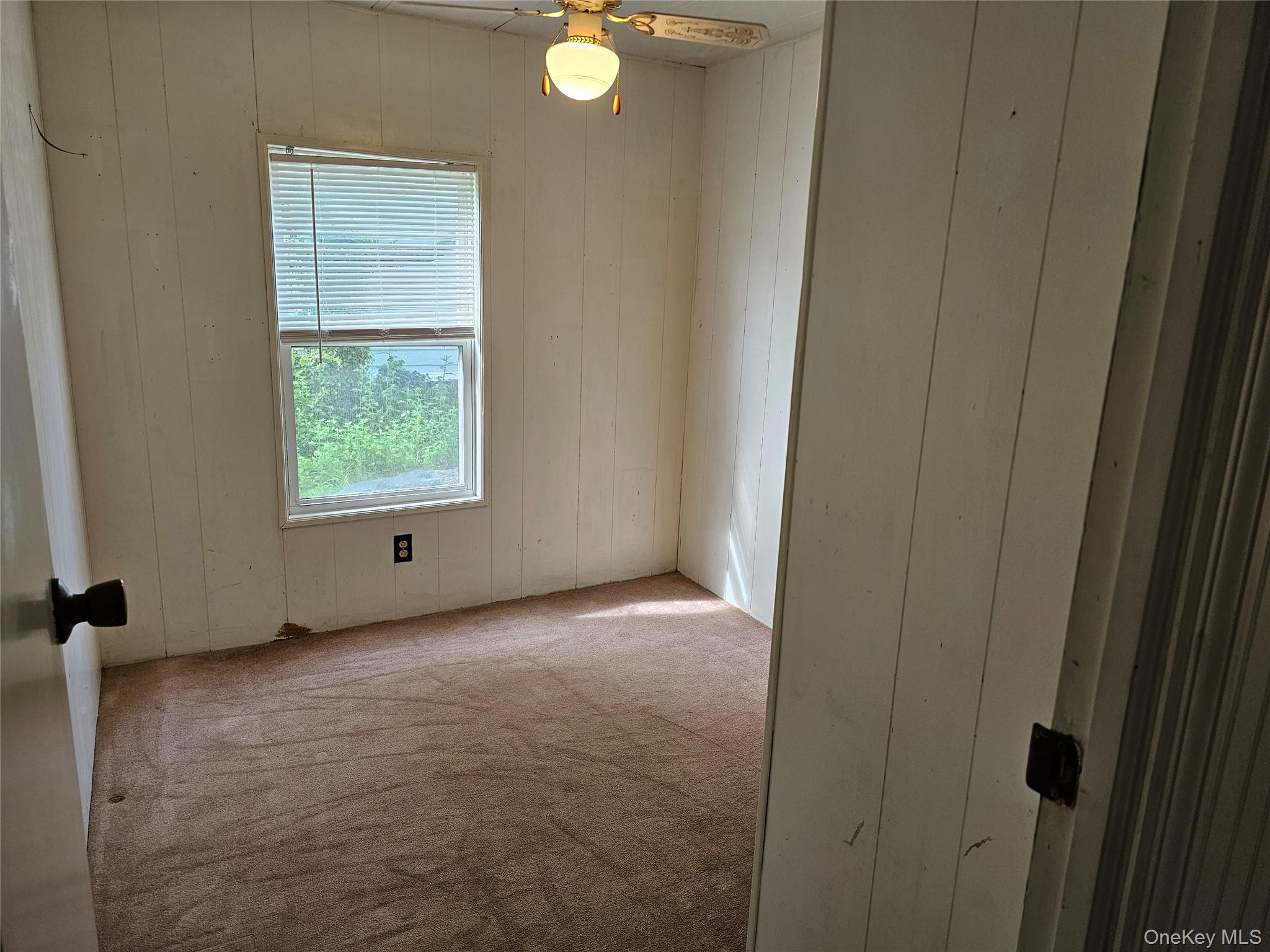 1964-106 River Road, Unit 106 Calverton, NY 11933 - Photo 15 of 26 a view of a room with window