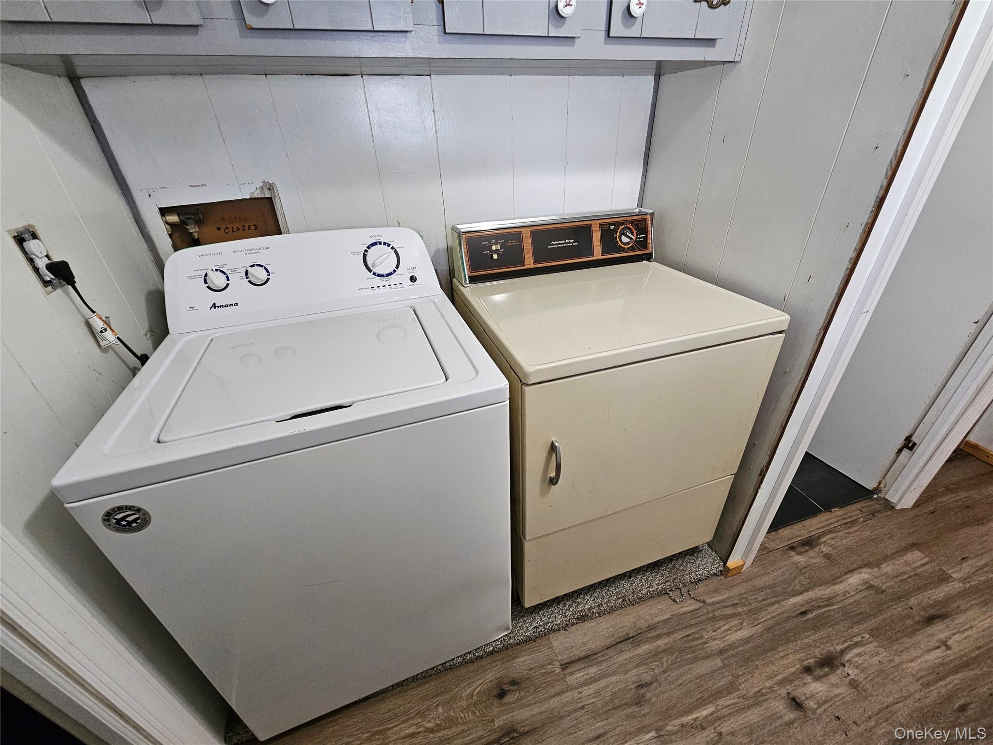1964-106 River Road, Unit 106 Calverton, NY 11933 - Photo 16 of 26 a utility room with dryer and washer
