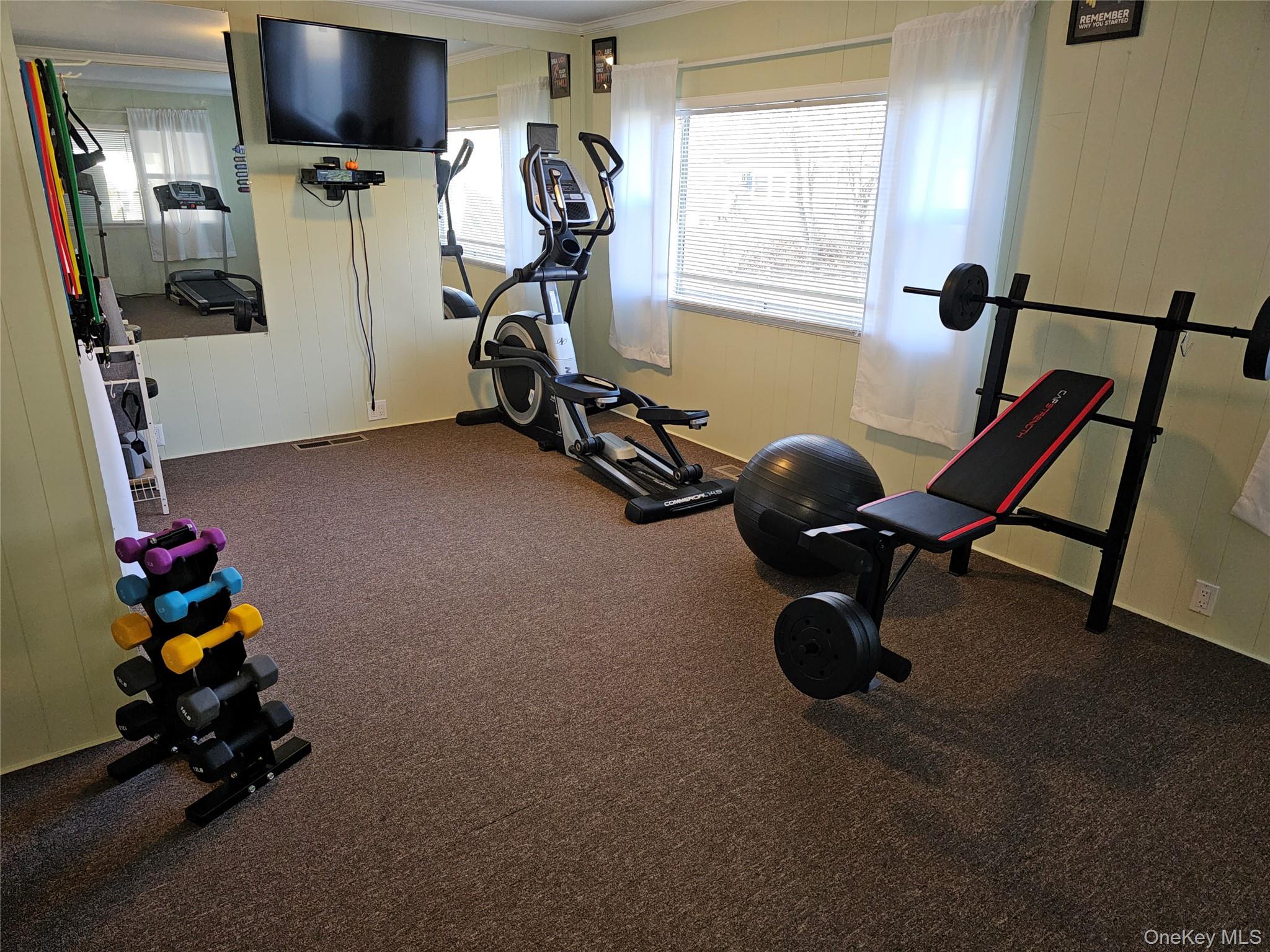1964-106 River Road, Unit 106 Calverton, NY 11933 - Photo 25 of 26 a view of a room with gym equipment