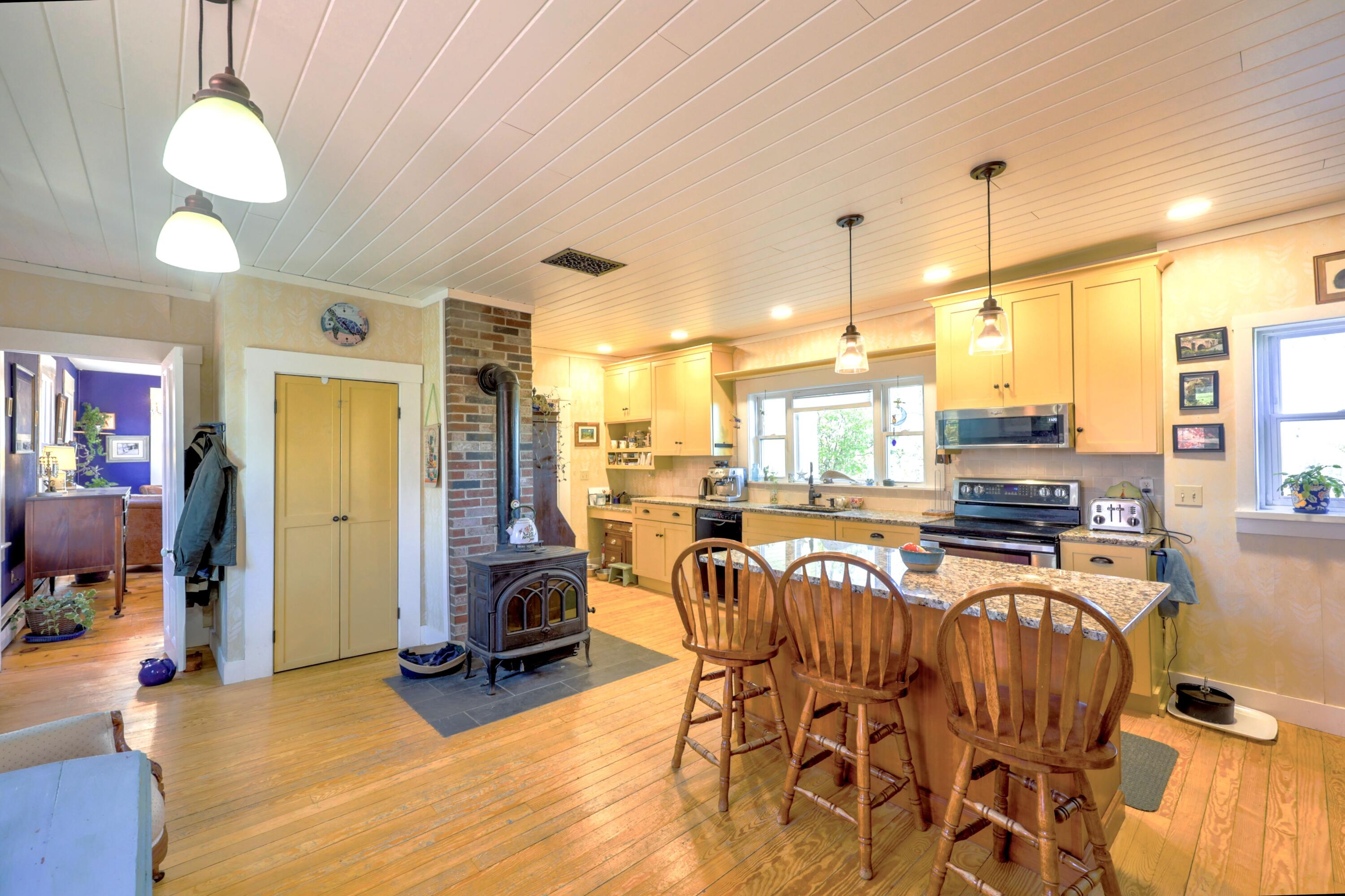 389 Higgins Road Pittsfield, ME 04967 - Photo 14 of 82 Kitchen with woodstove