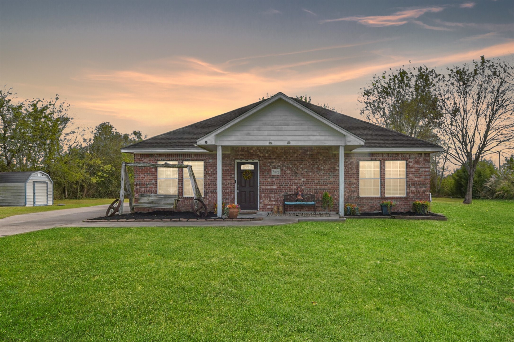 a big house with a big yard and large trees