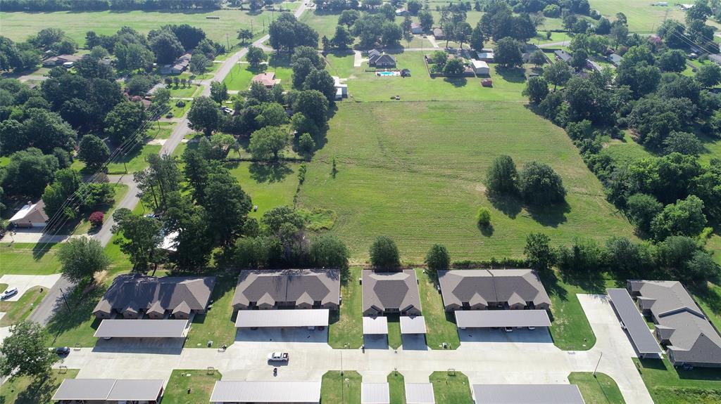 Tbd Pine Mill Road Paris, TX 75462 - Photo 2 of 7 a view of residential house with outdoor space and seating