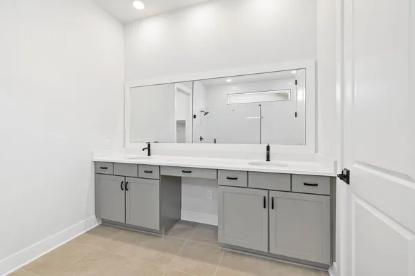 a bathroom with a tub shower and toilet