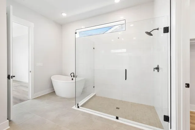 a white bath tub sitting in a bathroom
