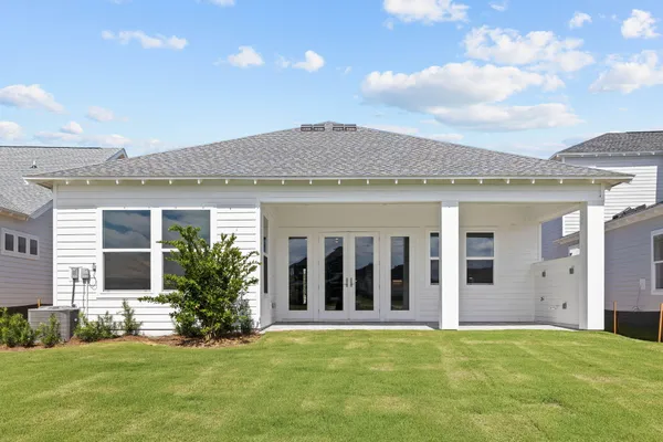 a view of a lake with houses in the back