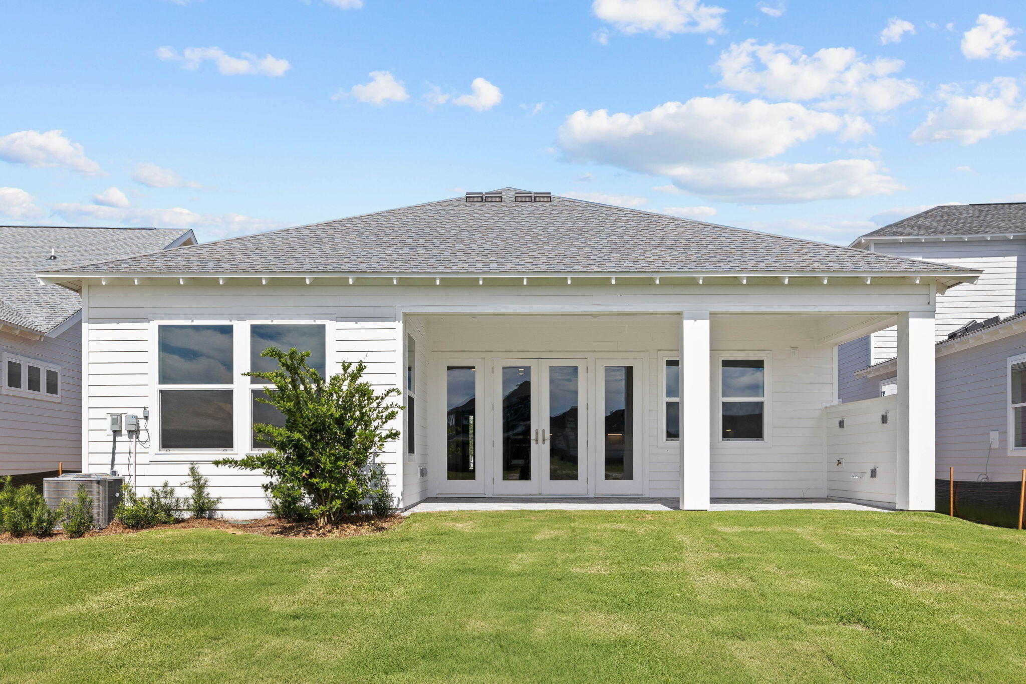 100 Anastasia Cir Inlet Beach Inlet Beach, FL 32461 - Photo 37 of 58 a view of an house with backyard porch and garden