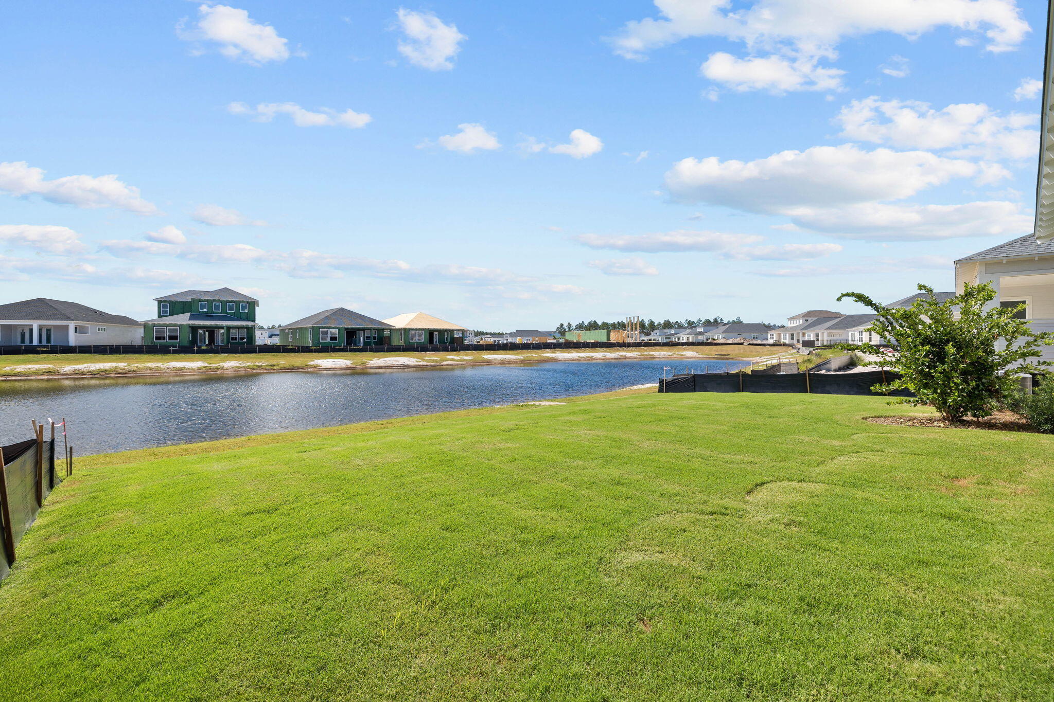 100 Anastasia Cir Inlet Beach Inlet Beach, FL 32461 - Photo 42 of 58 a view of a lake with houses in the back