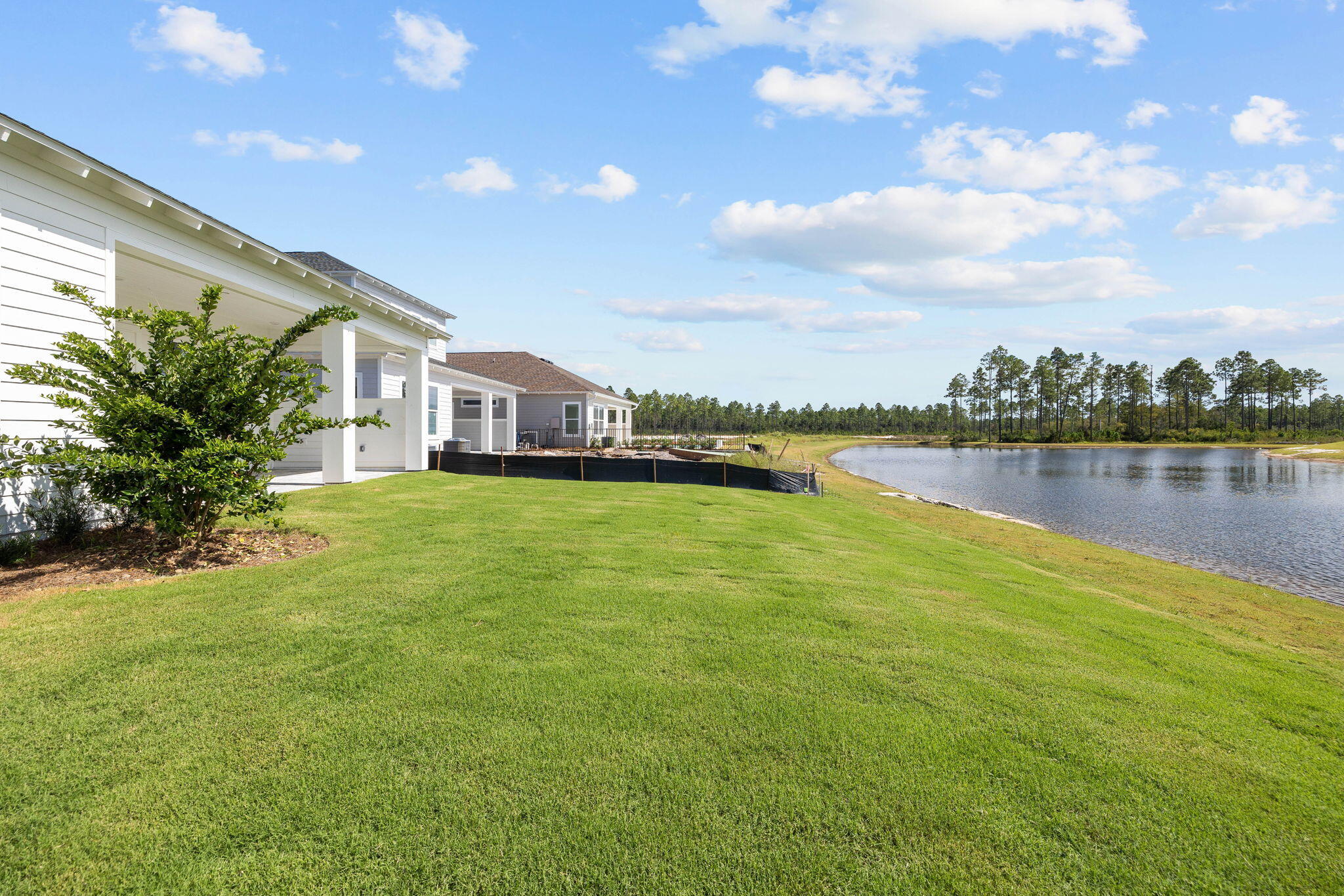 100 Anastasia Cir Inlet Beach Inlet Beach, FL 32461 - Photo 43 of 58 a view of a house with a yard and a lake view