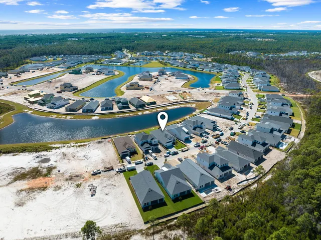 an aerial view of houses with yard