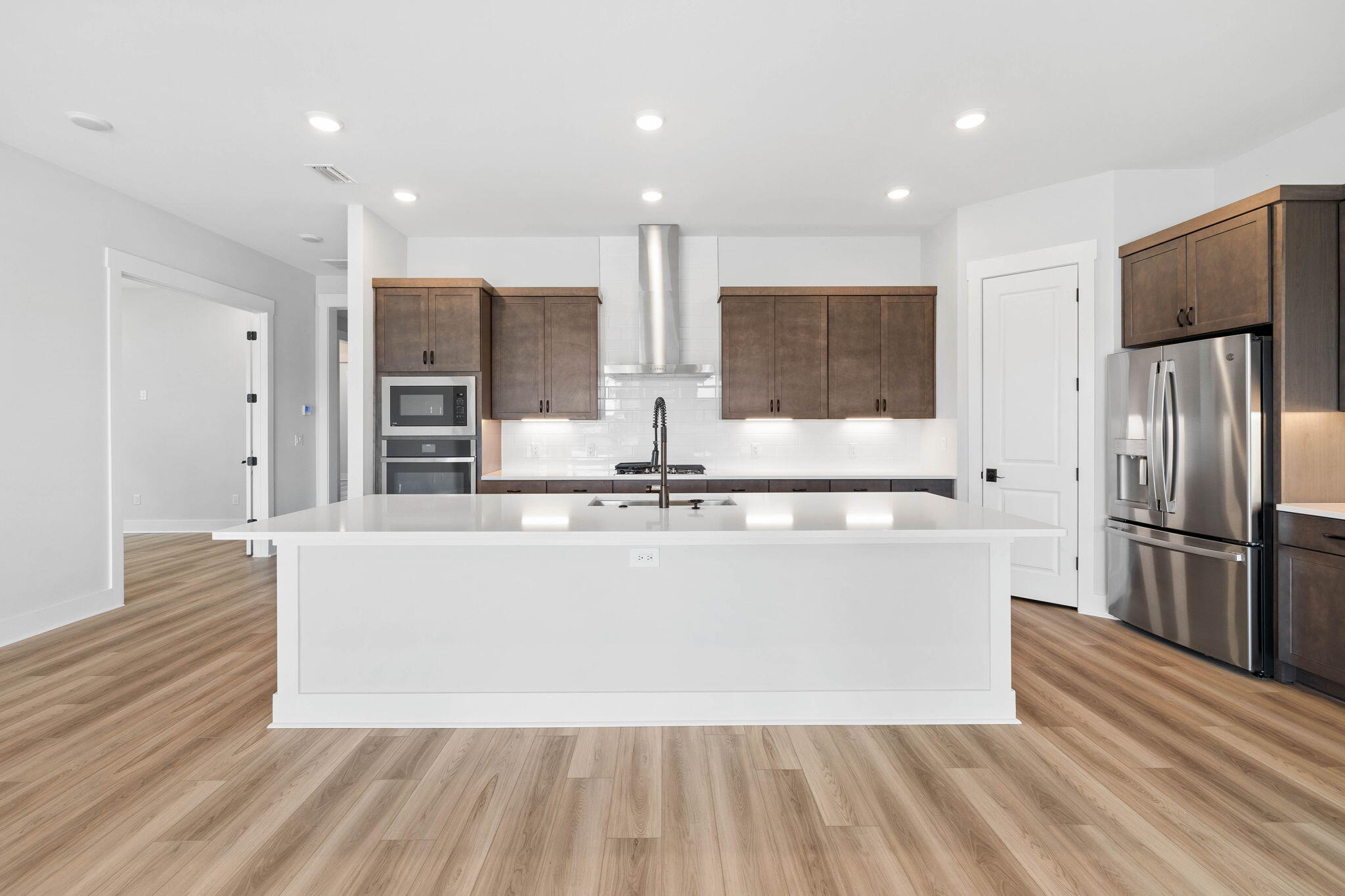 100 Anastasia Cir Inlet Beach Inlet Beach, FL 32461 - Photo 6 of 58 a large kitchen with stainless steel appliances a large counter top a stove and a refrigerator