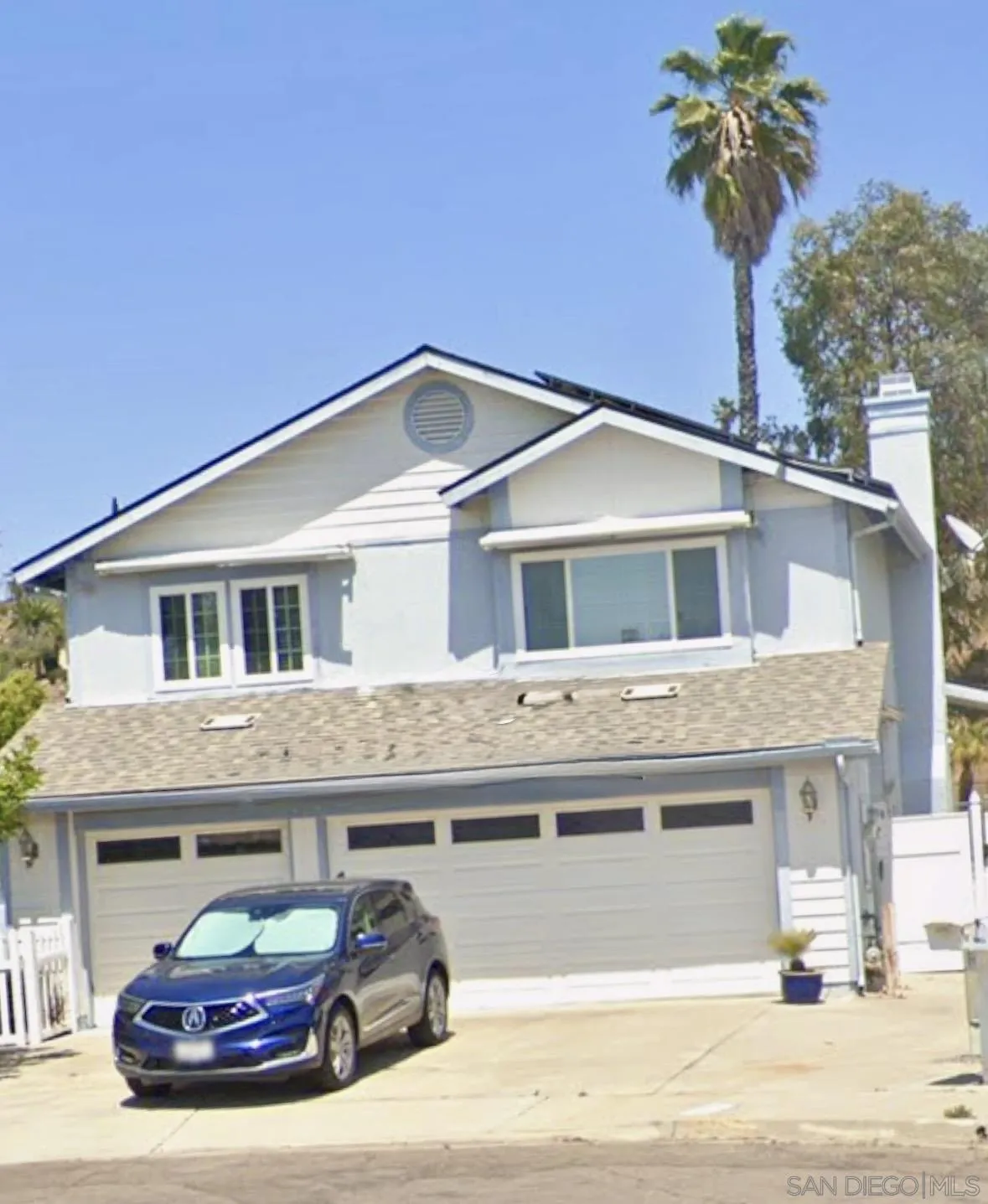 9167 Berkview Lane Spring Valley, CA 91977 - Photo 1 of 1 a car parked in front of white house