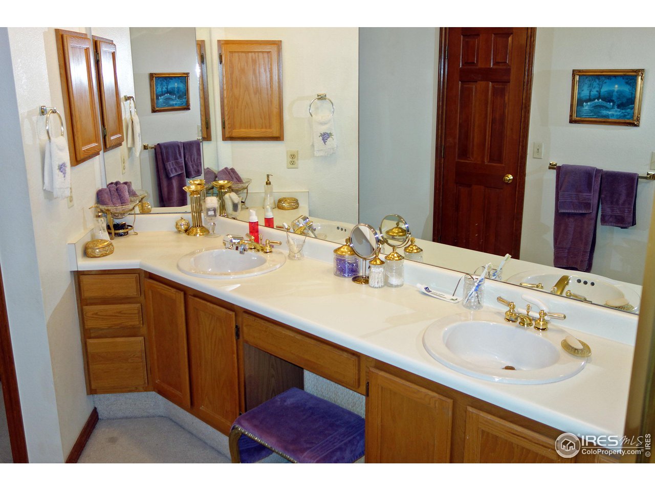 3349 Sentinel Drive Boulder, CO 80301 - Photo 13 of 25 a bathroom with a sink vanity and mirror